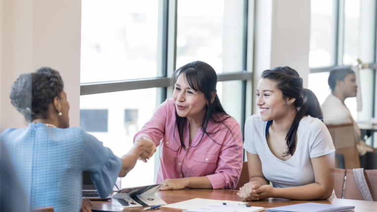 Mother and daughter meeting with investment advisor